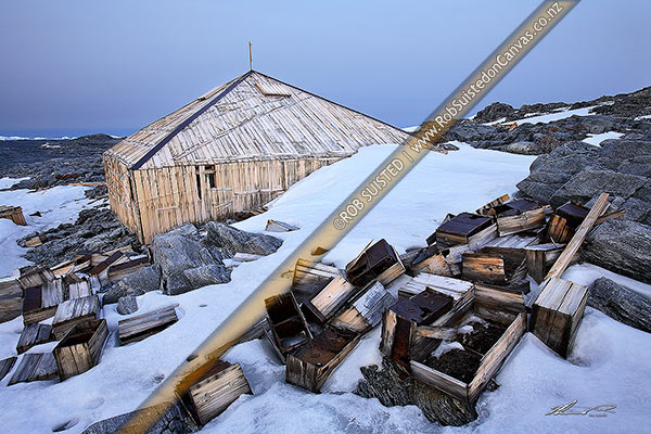 Photo of Artefact scatter of store crates behind the Historic 1912-14 Mawson's huts, Cape Denison -'Home of the Blizzard', Commonwealth Bay, Antarctica, Antarctica Region, Antarctica