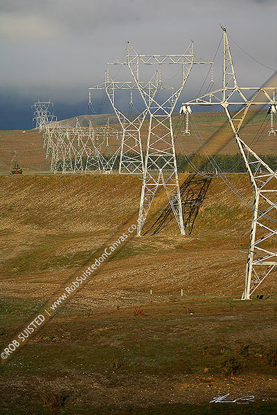 Photo of Power Pylons transmitting electricity across farmland in the MacKenzie Basin, MacKenzie Basin, MacKenzie, Canterbury Region, New Zealand (NZ)
