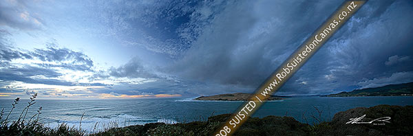 Photo of Moody stormy evening skies over the Hokianga Harbour Entrance and North Head from the Arai te Uru Heritage Walk. Omapere and Opononi right. Panoramic view, Omapere, Hokianga, Far North, Northland Region, New Zealand (NZ)