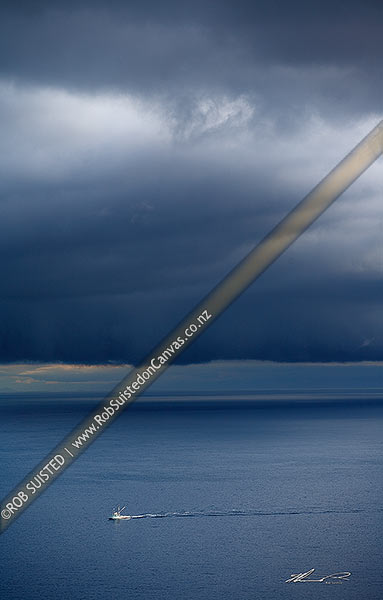 Photo of Running home before the storm. Fishing boat returning to port as a dramatic southerly weather front looms over Cook Strait. South Island under cloud, Cook Strait, Wellington City, Wellington Region, New Zealand (NZ)