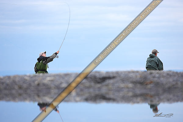 Photo of Trout fishermen angler casting on the Waitahanui Stream Mouth, Lake Taupo. Reflected in water, Taupo, Taupo, Waikato Region, New Zealand (NZ)