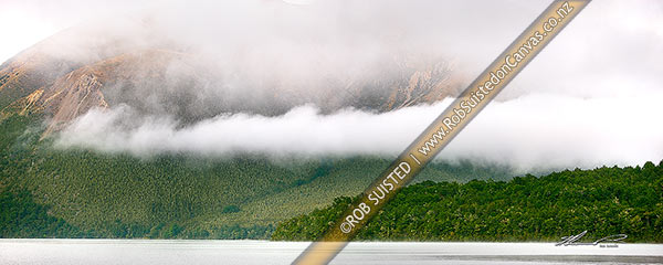 Photo of Moody early morning mist and cloud over water of Lake Rotoiti, Nelson Lakes National Park. Mt Robert behind. Beech forest cloaked hills. Panorama, St Arnaud, Tasman, Tasman Region, New Zealand (NZ)
