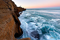 Waves surging against cliffs canvas print