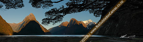 Photo of Milford Sound at dawn. Mitre Peak left (1683m), Stirling Falls and The Lion centre, with Mount Pembroke (2015m) with snow. Panorama, Milford Sound, Fiordland National Park, Southland, Southland Region, New Zealand (NZ)