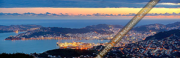 Photo of Wellington Harbour, CBD and City at twilight with lights glowing. Panorama from Evans Bay / airport to Wadestown (right), Cook Strait beyond, Wellington City, Wellington City, Wellington Region, New Zealand (NZ)