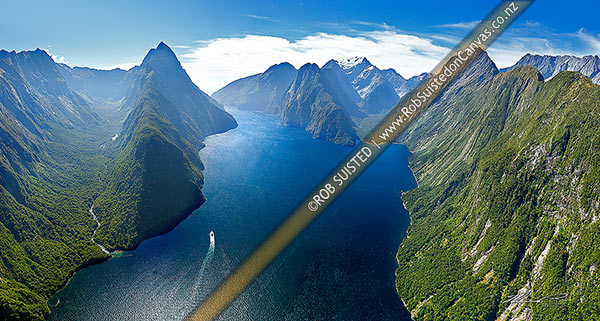 Photo of Looking down Milford Sound / Piopiotahi from near entrance. Sinbad Gully and Mitre Peak (1683m) left, The Lion (1302m), Mount Pembroke (2015m) centre, and Harrison Cove and Mills Peak right. Aerial panorama, Milford Sound, Fiordland National Park, Southland, Southland Region, New Zealand (NZ)