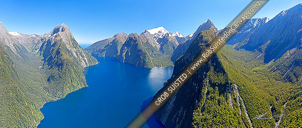 Photo of Milford Sound aerial view. Sinbad Gully & Mitre Peak (1683m) left, The Lion, Mt Pembroke and Harrison Cove centre, with Bowen River and Mt Grave right. Piopiotahi. Panorama, Milford Sound, Fiordland National Park, Southland, Southland Region, New Zealand (NZ)