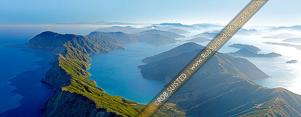 Photo of Arapawa Island and Marlborough Sounds aerial panorama. Onauku Bay in East Bay off Queen Charlotte Sounds. Kaikoura Ranges and Cloudy Bay distant, Cook Strait, Marlborough, Marlborough Region, New Zealand (NZ)