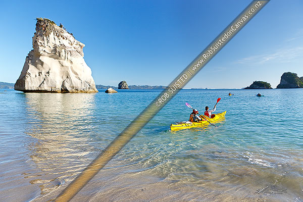 Photo of Cathedral Cove with sea kayakers kayaking in the early morning, Hahei, Coromandel Peninsula, Thames-Coromandel, Waikato Region, New Zealand (NZ)