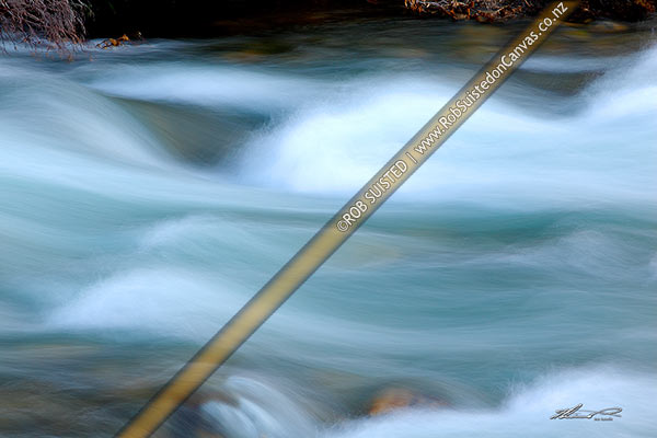 Photo of River rapids blurred with fast flowing water movements,, New Zealand (NZ)