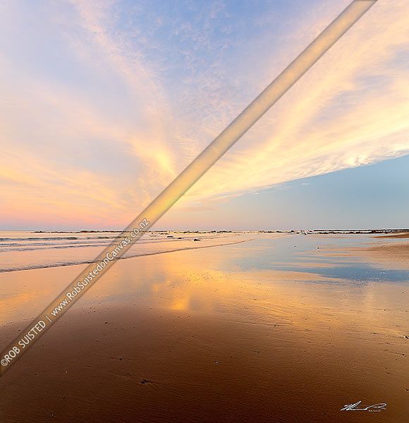 Photo of Golden wispy sunest clouds reaching across sky and reflecting in beach sands of Port Awanui. Square format, Port Awanui, Gisborne, Gisborne Region, New Zealand (NZ)