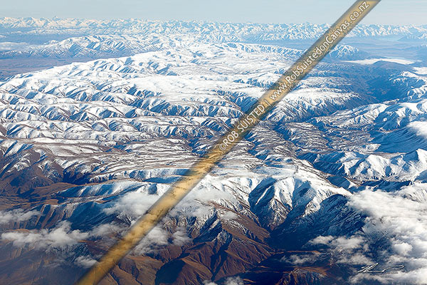 Photo of Hawkdun, Ida and Saint Marys Ranges in snow. Oteake, Mount Ida, and St Marys Conservation Areas. Aerial view with MacKenzie Basin far right, Naseby, Central Otago, Otago Region, New Zealand (NZ)