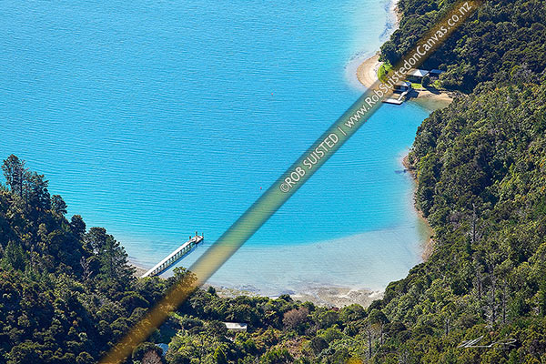 Photo of Maraetai Bay homes, wharves and jetties in a secluded forested bay, Marlborough Sounds, Marlborough, Marlborough Region, New Zealand (NZ)