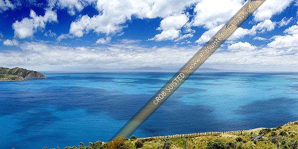Photo of Cloud patterns on Cook Strait. Ohau Point at left, South Island, Marlborough Sounds and The Brothers (right) in distance. Summer panorama from above Opau Bay, Makara Beach, Wellington City, Wellington Region, New Zealand (NZ)