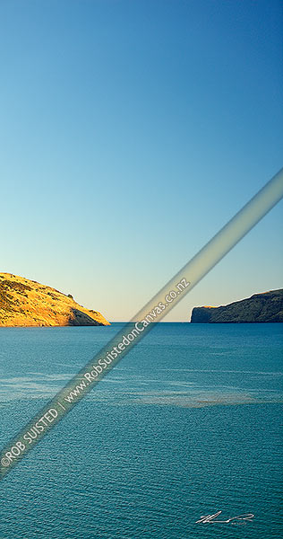 Photo of Akaroa Harbour entrance looking south on a late summer evening. Vertical panorama, Banks Peninsula, Christchurch City, Canterbury Region, New Zealand (NZ)