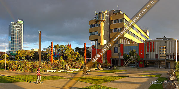 Photo of Palmerston North City Council building in The Square, with large Maori carvings in the gardens. Panorama, Palmerston North, Palmerston North, Manawatu-Wanganui Region, New Zealand (NZ)