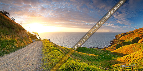 Photo of Coromandel panorama looking north from near Cape Colville to Little Barrier Island (Hauturu) on beaut summer evening sunset. Farmland and dirt road, Cape Colville, Thames-Coromandel, Waikato Region, New Zealand (NZ)