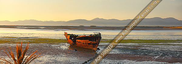Photo of Wreck of the Jaine Seddon on Motueka foreshore. As an Examination Vessel for Wellington Harbour during the World Wars it's said she fired the first shots of the WWII. Panorama, Motueka, Tasman, Tasman Region, New Zealand (NZ)