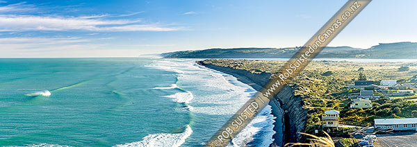 Photo of Port Waikato beach in front of surf club, with surfers enjoying waves. Black ironsands beach and dunes with Waikato River mouth beyond, and Whatipu Heads in distance left. Panorama, Port Waikato, Franklin, Waikato Region, New Zealand (NZ)
