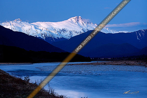 Photo of Mount Hooker (2652m centre) Mt Cullaugh (2286m left) above the Haast and Landsborough Rivers at dusk in winter, Haast, Westland, West Coast Region, New Zealand (NZ)