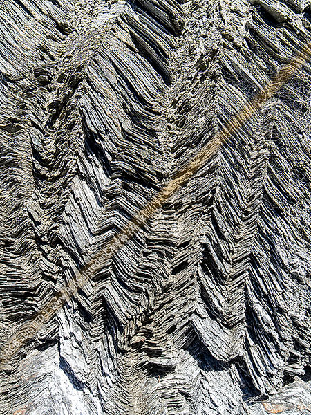 Photo of Shotover River geology with dramatically folded, warped and bent layers in rock, Shotover River, Queenstown Lakes, Otago Region, New Zealand (NZ)