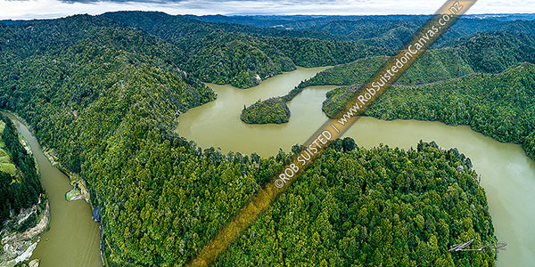 Photo of Lake Rotorangi, behind the Patea Dam on the Patea River. A 46km long man made hydro power lake. Aerial panorama. Tarere Conservation Area forest, Patea, South Taranaki, Taranaki Region, New Zealand (NZ)