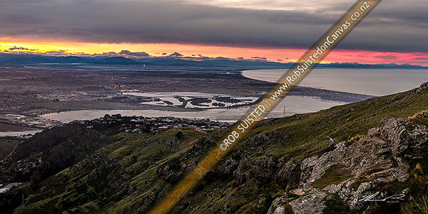 Photo of Christchurch City and Canterbury plains on a calm winter evening. Heathcote and Avon Estuary, and Pegasus Bay at right. Sunset panorama, Port Hills, Christchurch, Christchurch City, Canterbury Region, New Zealand (NZ)