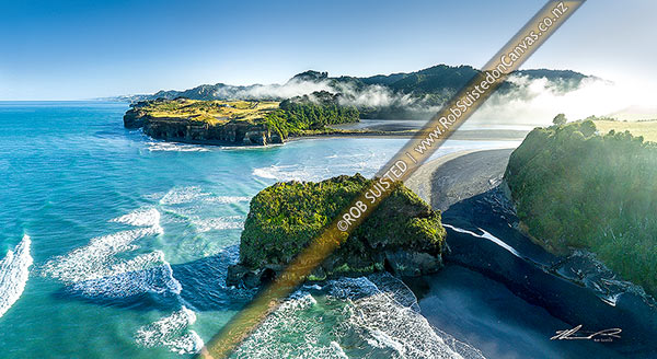 Photo of Tongaporutu River mouth on the North Taranaki coast, as morning inversion cloud flows down river valley. Aerial view looking north past the Three Sisters rocks.  Aerial view, Tongaporutu, New Plymouth, Taranaki Region, New Zealand (NZ)