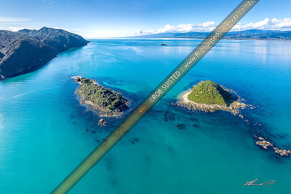 Photo of Kapiti Island (left) with Motangarara Island (Fishermans Is.) centre and Tahoramaurea Island (Browns Is.) right. Aerial view over Rauoterangi Channel towards Paraparaumu, Kapiti Island, Kapiti Coast, Wellington Region, New Zealand (NZ)