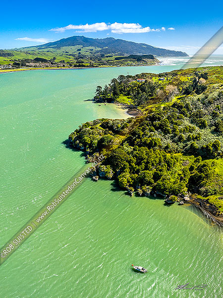 Photo of Raglan Harbour and entrance, seen from Marotaka Point Te Akau, across the harbour from Raglan town. Mt Karioi (756m) distant. Aerial view, Raglan, Waikato, Waikato Region, New Zealand (NZ)
