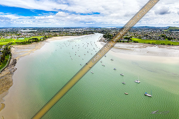 Photo of Tamaki River, looking up the tidal inlet towards Pakuranga and Panmure suburbs. Aerial view over vessels moored in the channel, Pakuranga, Auckland City, Auckland Region, New Zealand (NZ)
