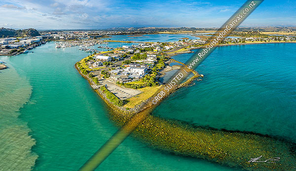 Photo of Napier Ahuriri Estuary Channel, with commercial boat harbour and marina left, and Westshore at right. Aerial view, Napier, Napier City, Hawke's Bay Region, New Zealand (NZ)
