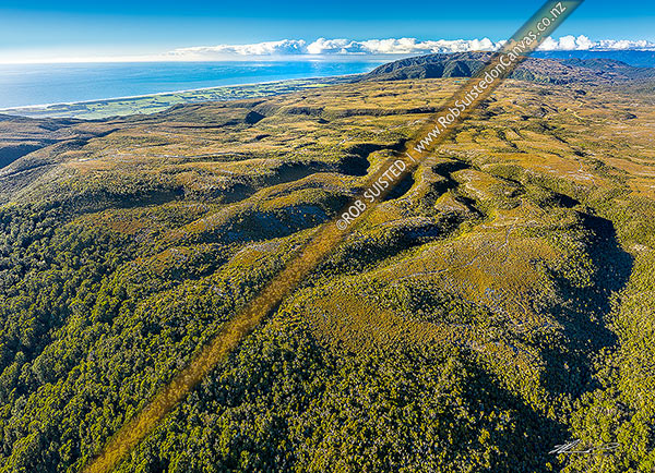 Photo of Denniston-Stockton Plateau, seen from south looking Rochfort Stream towards Waimangaroa and coast. Mt Fredercick (1105m) distant right. Aerial view, Denniston, Buller, West Coast Region, New Zealand (NZ)